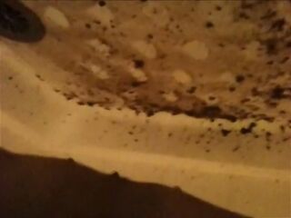 Woman shitting a very liquid diarrhea in the shower